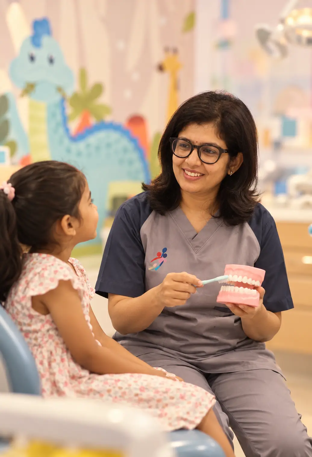 Dr. Bhuvanesswari with a child patient at Chutti's Dental